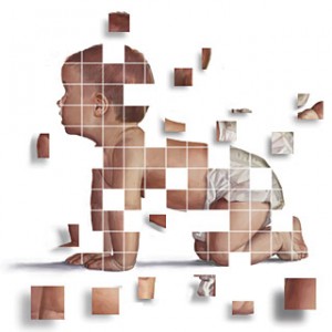 A baby being built out of puzzle pieces.